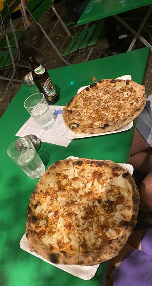 Pizza with ananas and sausage, and carbonara pizza  at Planty Pizza in Vienna
