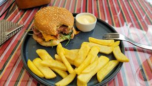 Tasty burger and chips at Restaurant Kaerajaan in Tallinn