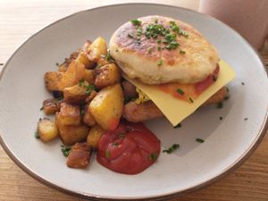 giant breakfast muffin with fried potatoes at The Pie Box Cafe in Cardiff