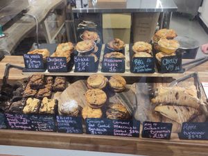 The Pie Box Cafe - Cardiff, UK - some food with prices. It was 1 hour before closing, so less than they would usually display. There were more cookies on another display. #Veganuar at The Pie Box Cafe in Cardiff