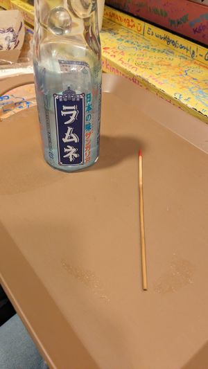 Winner Skewer with red tip! And the price drink I've chosen at OKO Takoyaki in Osaka