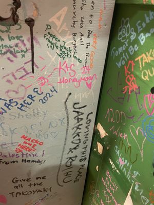 Fun writing on wall  at OKO Takoyaki in Osaka