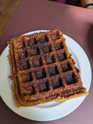 Burnt Miso waffle that we returned. Something this burnt should not be served. I've never been served something this burnt in my life. at Sfera in Berlin