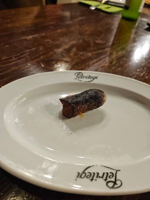 Looks burnt and unappealing, was delicious! at Petritegi Sagardotegia in Astigarraga