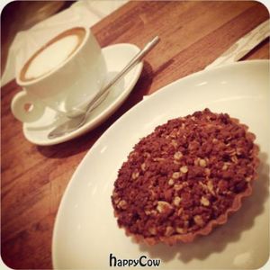 Cappuccino with almond milk, and Cinnamon & Apple Crumble Pie  at Cafe Pinson - Marais in Paris