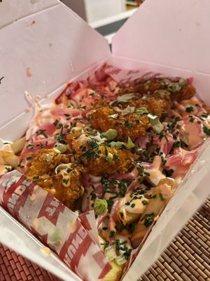 Fries with cheddar, bacon, onion and fried shrimp 10€ at least for two at Thunder Vegan - La Latina  in Madrid