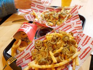 Jalapeño fries, onion rings, and prawn fries in the background #Veganuary at Thunder Vegan - La Latina  in Madrid