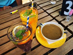 Vegan lentil cream soup, mango and lavender lemonade at Vasmacska KávéZoo in Budapest