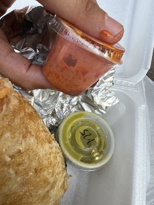 Not enough sauce in the to go containers but such a large (yay) burrito  at Mezkla Taqueria in Holland