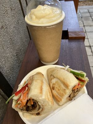 “Mango delight" smoothie and “bahn mi bon appetit”  at O Plant-based - Nguyễn Đình Chiểu in Ho Chi Minh City