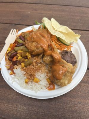 Chili beans with rice, salad, chocolate banana pudding for $10 + I added a poppadom and a potato fritter for $1 each   at Conscious Eats in Auckland