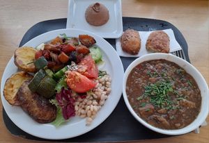 Vegan spicy stew, beans, vegetables and a vegan chocolate dessert. at Restaurant Mau-Kas in Espoo
