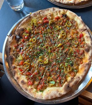 Vegan pizza with grilled pepper and eggplant, tomatoes, pickled jalapeño and zatar spices. Amazingly good!  at Hoggorm in Bergen