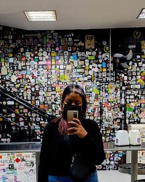 Downstairs... Amazing stickers collection at Prime Dog - Vila Mariana in Sao Paulo