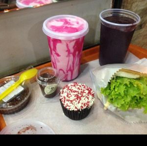 Negresco pie, brigadeiro, mulberry cupcake, strawberry milkshake, acai juice and 'cheff's burger'. at Prime Dog - Vila Mariana in Sao Paulo