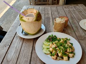 Laab salad, coconut juice, sticky rice at Phakhao Lao Restaurant in Vientiane