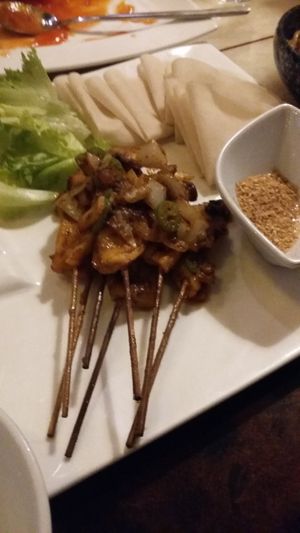 Sichuan BBQ: stir-fried king oyster with rice pancakes at Eat East in Stockholm