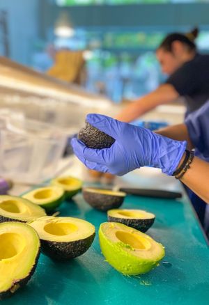 Preparing the fresh avocado at Noa Poke Koukaki in Athens