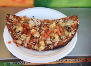 Avatara at the stampede, special 'cowboy' pizza with mushrooms, pineapple, sundried and fresh tomatoes, and daiya cheese at Avatara Pizza in Calgary