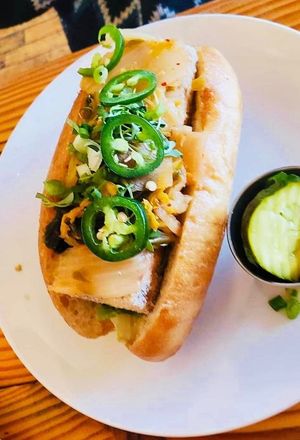 banh mi with fried tofu, chipotle mayo, kimchi, cilantro, scallions, jalepenos (with obligatory side pickle) at Cleveland Vegan in Lakewood