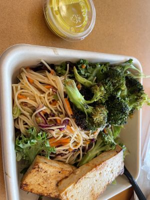 Noodles and greens, tumeric tahini on side  at Little Beet in Garden City