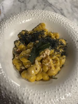 Homemade pumpkin gnocchis in vegan sage butter and black vegan Parmesan   at Plant Bistro in Ubud
