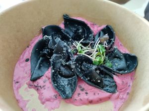 Charcoal tortellini filled with vegan goats cheese on creamy beet sauce #Veganuary at Plant Bistro in Ubud