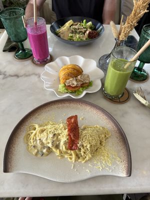 Carbonara, protein bowl, red Dragon, and green shake, turmeric, tuna, croissant  at Plant Bistro in Ubud