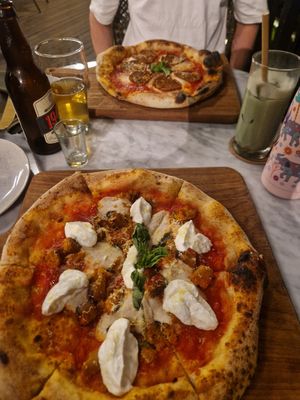 Pizzas - pepperoni at the back mine was Marscapone and sausage at Plant Bistro in Ubud
