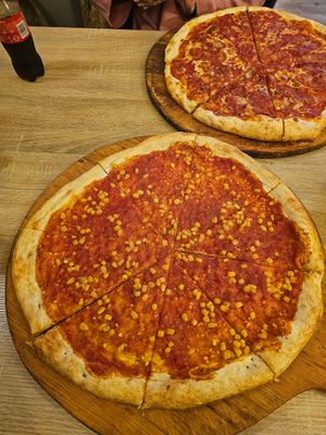 Pizza with vegan cheese and corn at Pizza Piccolino in Gyor