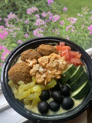Falafel grain bowl with lentil sauce and veggies  at Jasmine Restaurant Cafe in Rochester