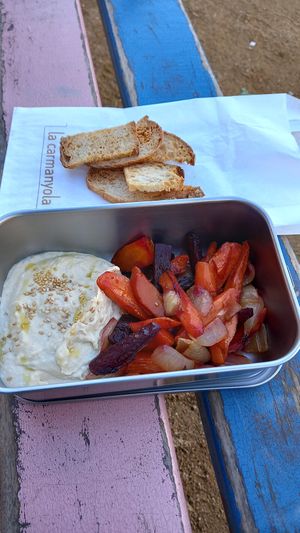 "half menu" (1 starter, 1 main) in own box 6,20€ at La Carmanyola in Girona