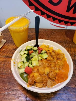 Vegan mango lassi and vegan chicken curry bowl at Bombay Sandwich Co. in New York City