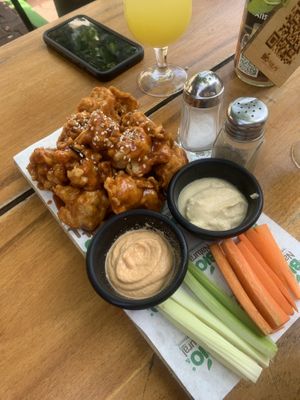 Cauliflower wings. Decent but could use more seasoning in the batter. Also wish it was served with a vegan ranch   at Bio & Natural - Con Constituyentes in Playa Del Carmen