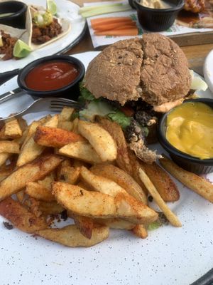 Burger and fries. The burger was not good unfortunately. The fries looked very seasoned but were somehow also lacking in flavor   at Bio & Natural - Con Constituyentes in Playa Del Carmen