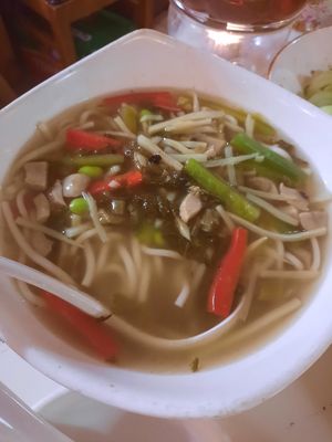Noodle soup with couple of green beans and red capsicum on top at Gong De Lin in Melbourne