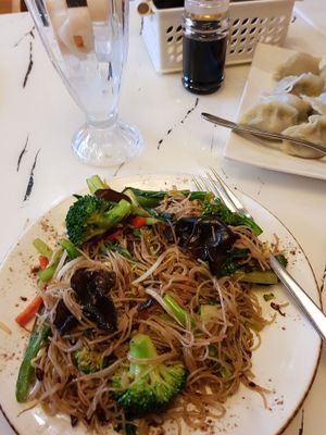 Stir fried rice noodles with vegetables, lychee drink, boiled dumplings at Gong De Lin in Melbourne