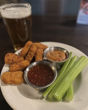 Lucky Bird Nuggets with sweet chili peanut, sweet chili sauce, and local beer option 🍻❤️  at Pizza Luce - Lyndale Ave in Minneapolis