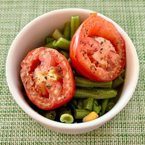 Sautéed veg and grilled tomatoes  at Al Mizah Restaurant in Abu Dhabi
