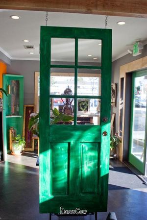 Green door, an art, hanging for no apparent reason. at Mead's Green Door Cafe in Orange