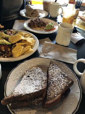 Stuffed French toast (with cream cheese and jam), chili over chickpea “egg”, blue plate special (gravy covered breakfast burrito). All vegan  at Mead's Green Door Cafe in Orange