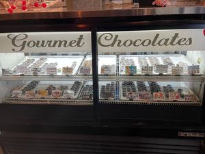 Display for gourmet chocolates. Prices range from $1-3. All vegan, except some with honey. at Oh Mi Organics in St Johns