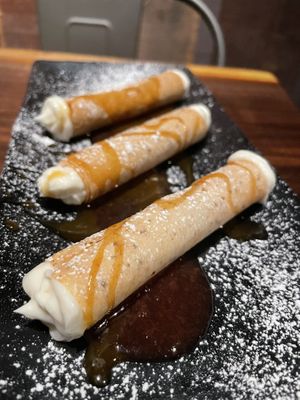 Vegan cannoli “cheesecake” filling with plant based caramel and cherry sauce   at Dharma Bums in New Hope
