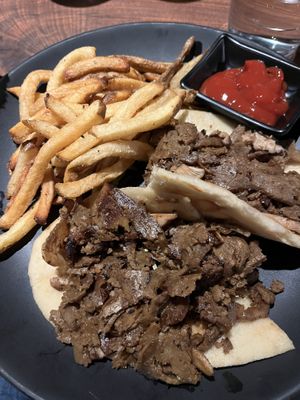 Vegan seitan cheesesteak without the cheese, with caramelized onions and mushroom on naann  at Dharma Bums in New Hope