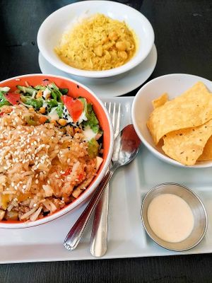 Sweet chili tofu basmati bowl with a side of chickpea curry at Flatbelly Veg in Erdenheim
