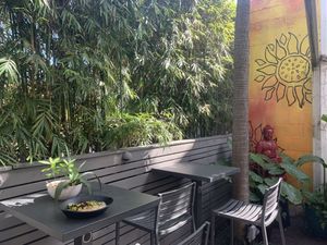 Green space makes outdoor dining pleasant. at Green Bar and Kitchen in Fort Lauderdale