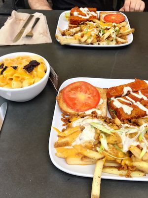 Buffalo tempeh sandwiches with loaded fries and a side of mac ‘n cheese.  at Green Bar and Kitchen in Fort Lauderdale