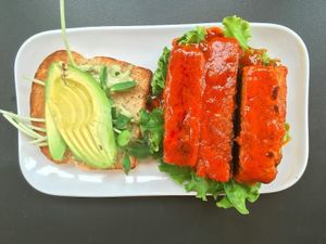 Buffalo Tempeh on gluten free bread with extra Avocado at Green Bar and Kitchen in Fort Lauderdale
