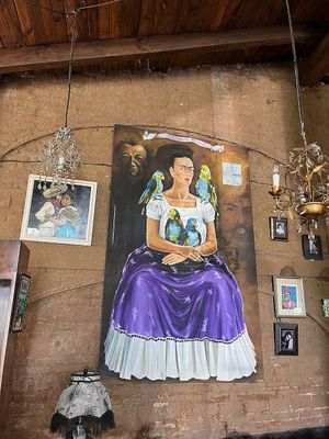 Frida with parrots at El Rincon De Frida in Jocotepec