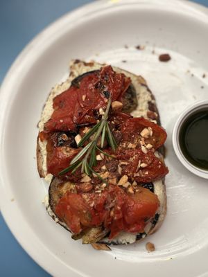 toast com pasta de castanha de caju fermentada, tomate assado, abobrinha, berinjela e amêndoa!  at Santiago Padaria Artesanal  in Sao Paulo